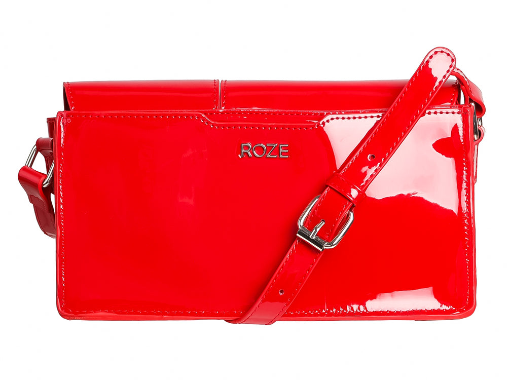 Bolso ROZE de color rojo brillante con acabado tipo charol y cierres metálicos plateados.