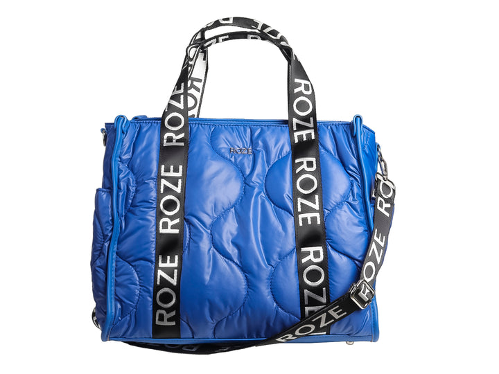 Bolso de hombro azul brillante con diseño acolchado y asas negras con letras blancas de la marca ROZE.