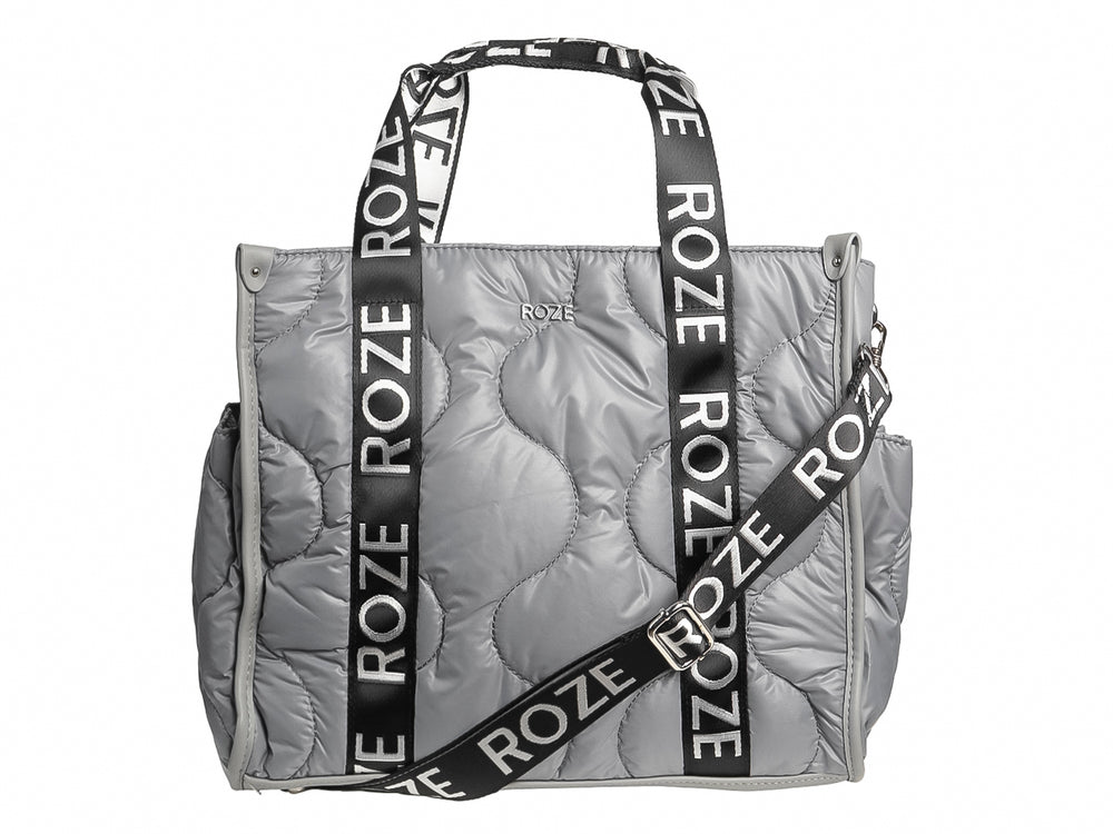 Bolso de hombro ROZE color gris con acabado acolchado y asas negras con logotipo blanco.