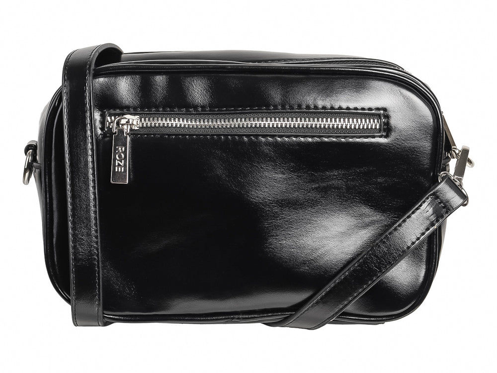 Bolso de hombro negro marca ROZE con un diseño de estrella blanca prominente en el frente y acabado brillante.