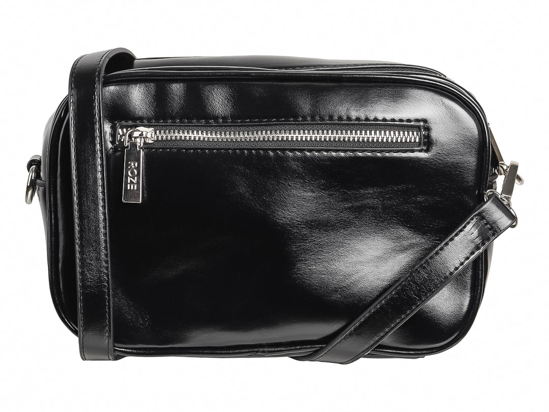 Bolso de hombro negro marca ROZE con un diseño de estrella blanca prominente en el frente y acabado brillante.