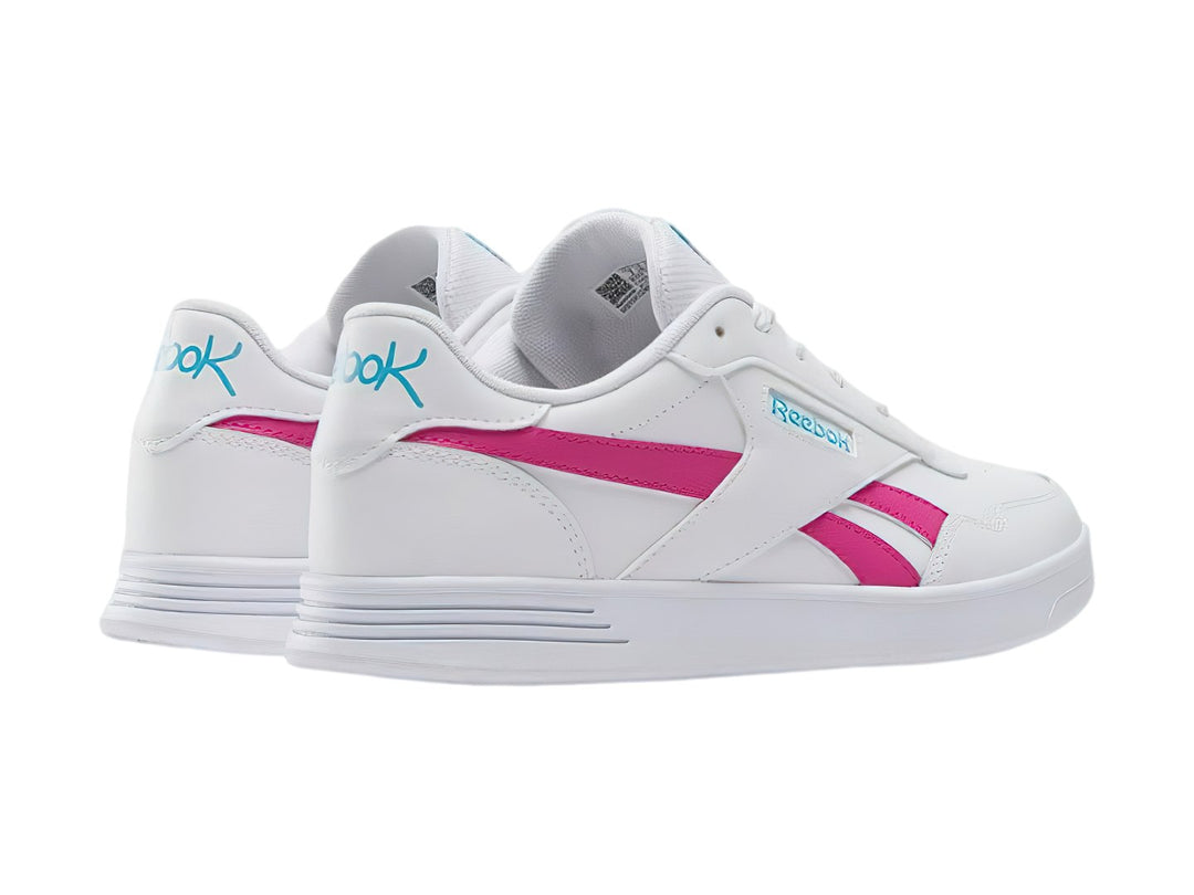 Tenis Reebok blancos con franjas laterales en color rosa y logotipo en azul, diseño deportivo de corte bajo.