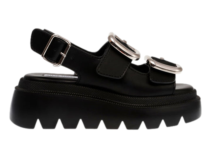 Sandalias negras de plataforma Steve Madden con suela dentada y hebillas plateadas.