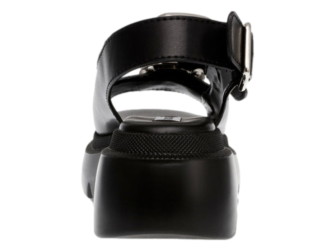 Sandalias negras de plataforma Steve Madden con suela dentada y hebillas plateadas.