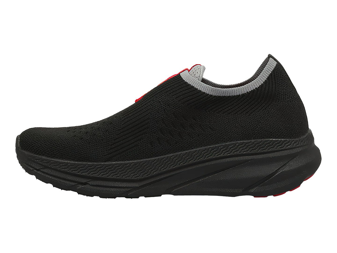 Tenis deportivos Lotto color negro con detalles en rojo y gris, diseño slip-on sin cordones.