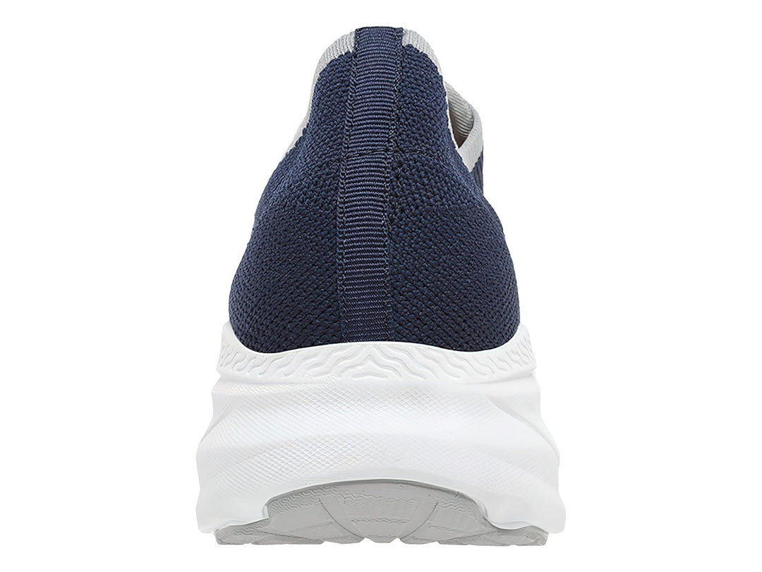 Tenis deportivos Lotto color azul marino con suela blanca y detalles en naranja, estilo slip-on.