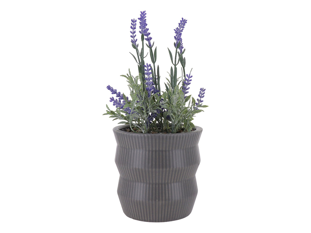 Planta artificial de lavanda morada en maceta decorativa de dolomita color gris con textura acanalada.