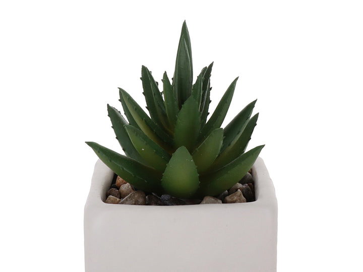 Planta artificial suculenta verde en maceta cuadrada blanca de dolomita.