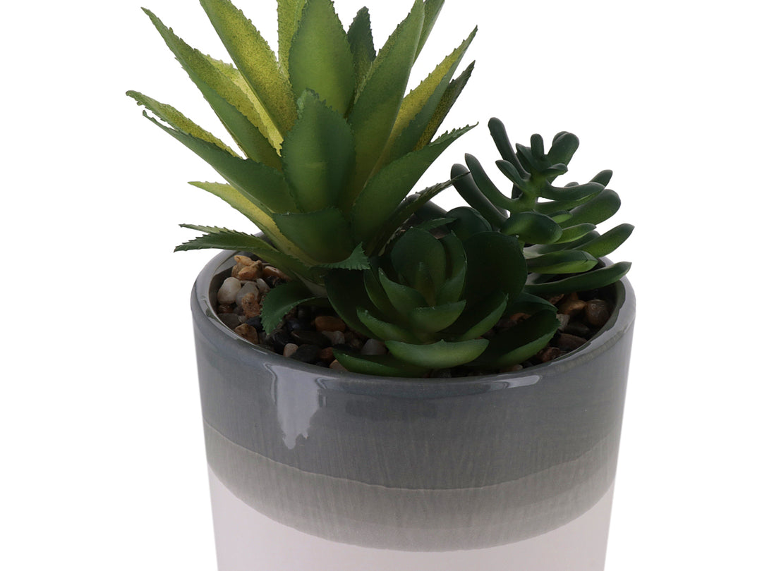 Planta artificial verde en maceta cilíndrica bicolor blanco y gris.