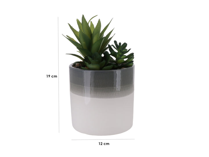 Planta artificial verde en maceta cilíndrica bicolor blanco y gris.