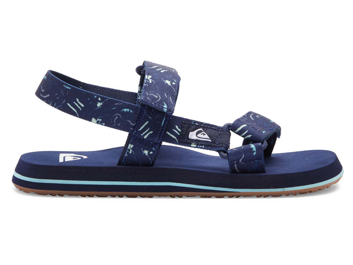 Sandalia Quiksilver azul marino con correas ajustables y suela con franja azul claro.