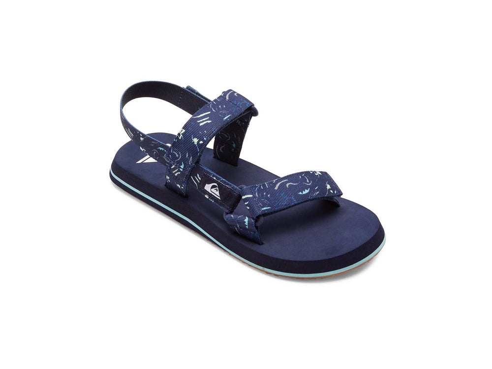 Sandalia Quiksilver azul marino con correas ajustables y suela con franja azul claro.