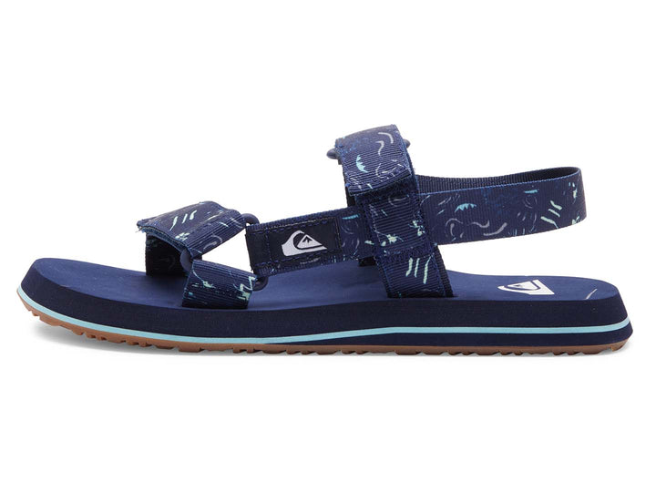 Sandalia Quiksilver azul marino con correas ajustables y suela con franja azul claro.