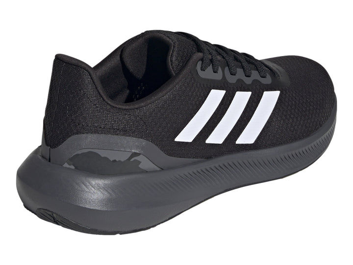Tenis deportivos Adidas Runfalcon 3.0 color negro con tres franjas blancas laterales y suela gris oscuro.