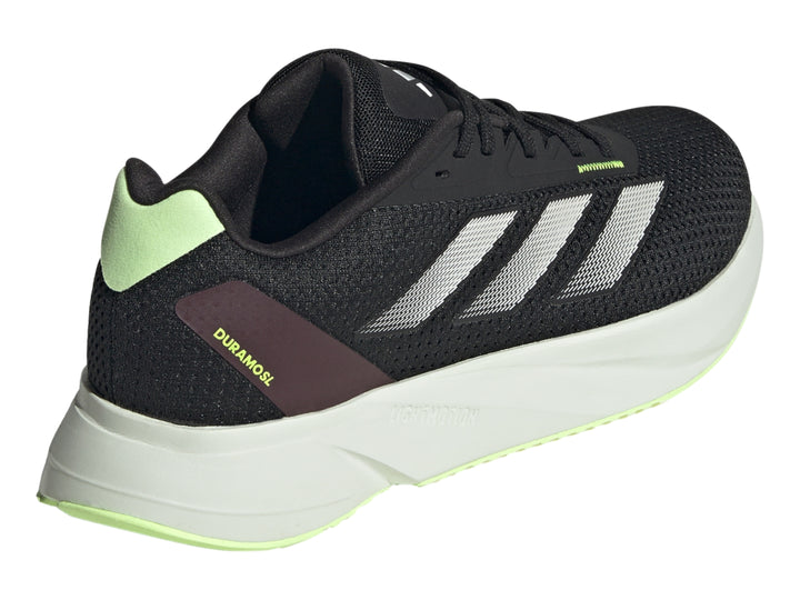 Tenis deportivos Adidas color negro con rayas plateadas y suela gris claro.
