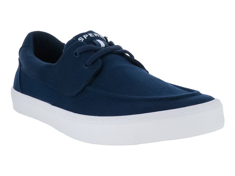 Zapatillas Sperry de tela color azul marino con suela blanca y cordones.