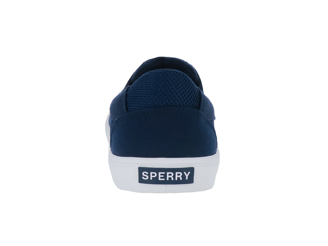 Zapatillas Sperry de tela color azul marino con suela blanca y cordones.
