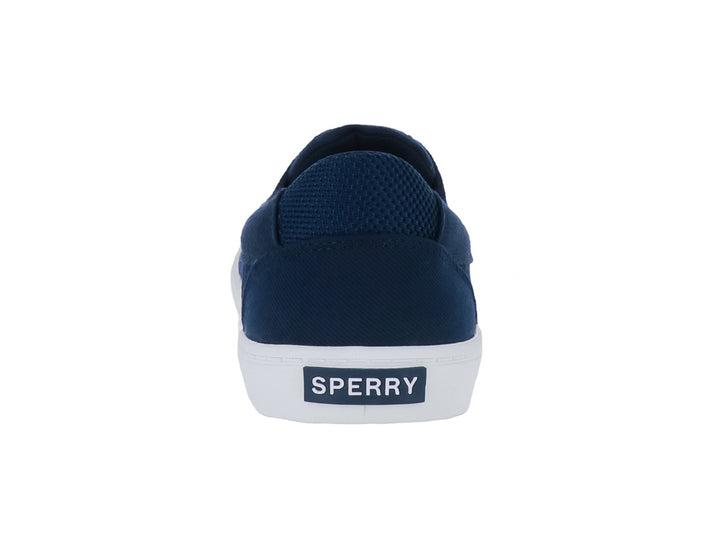 Zapatillas Sperry de tela color azul marino con suela blanca y cordones.