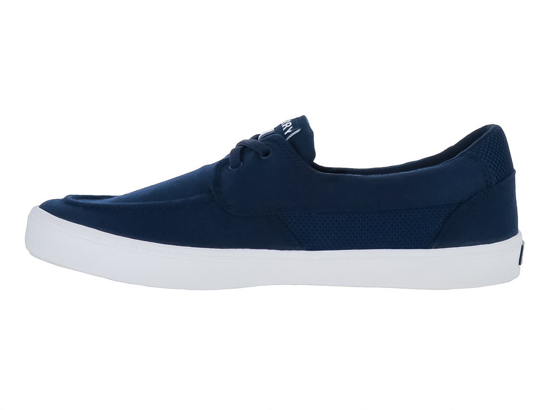 Zapatillas Sperry de tela color azul marino con suela blanca y cordones.