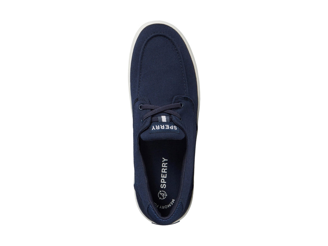 Zapatillas Sperry de tela color azul marino con suela blanca y cordones.
