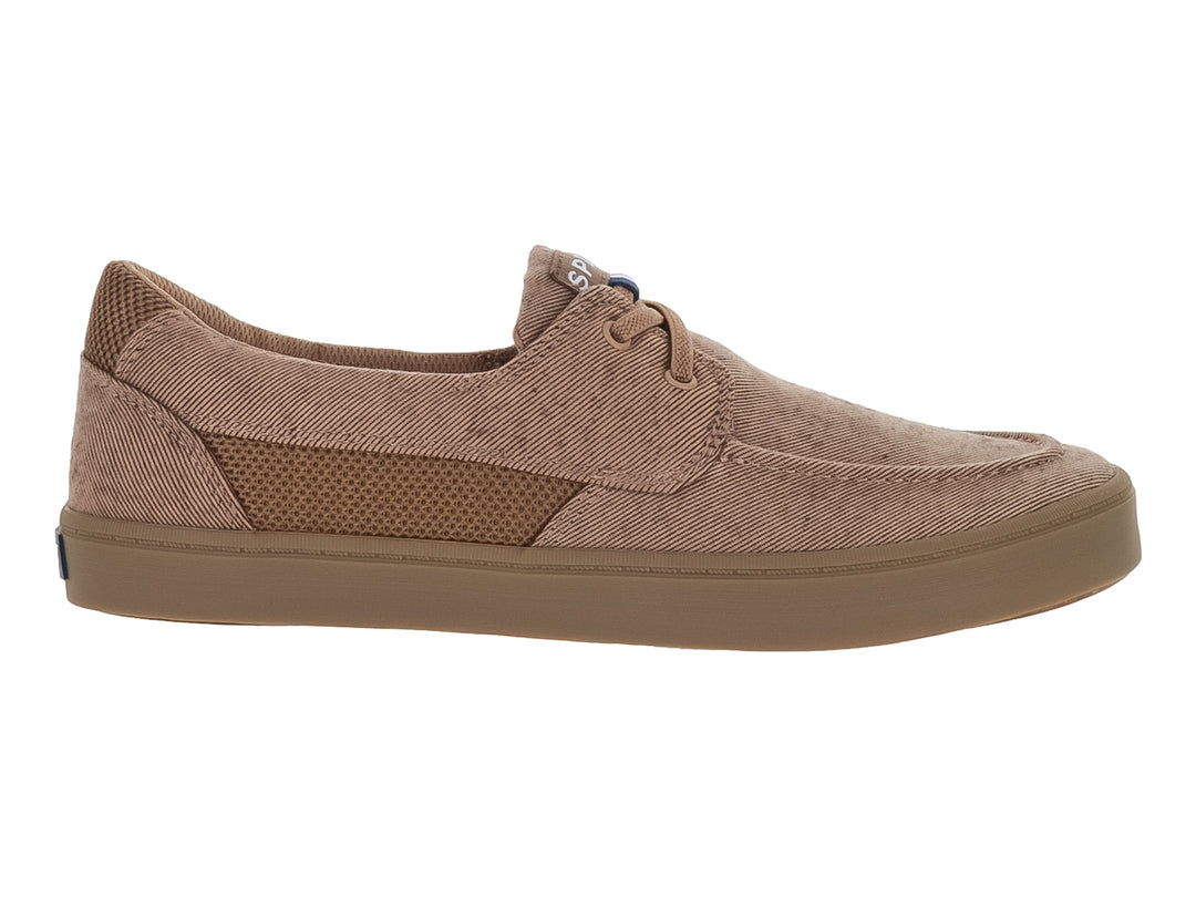 Zapato casual de tela color arena con suela plana y cordones.