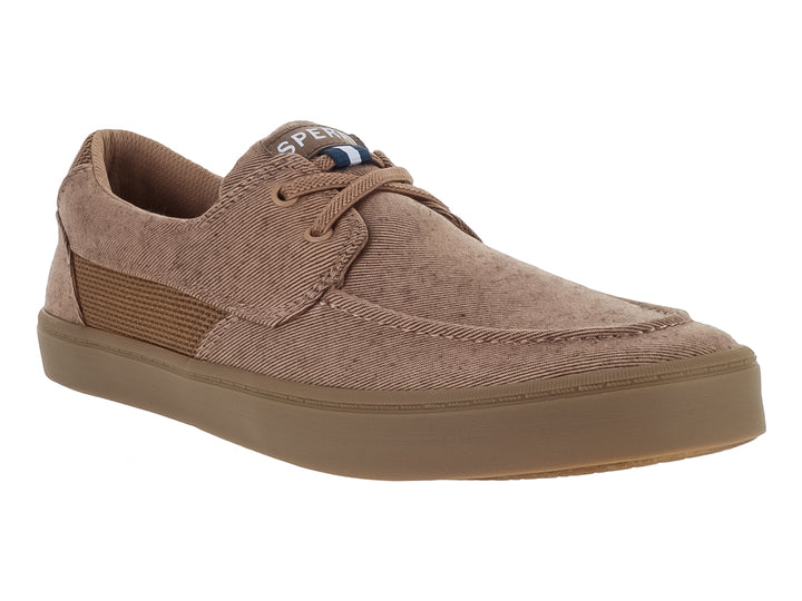 Zapato casual de tela color arena con suela plana y cordones.