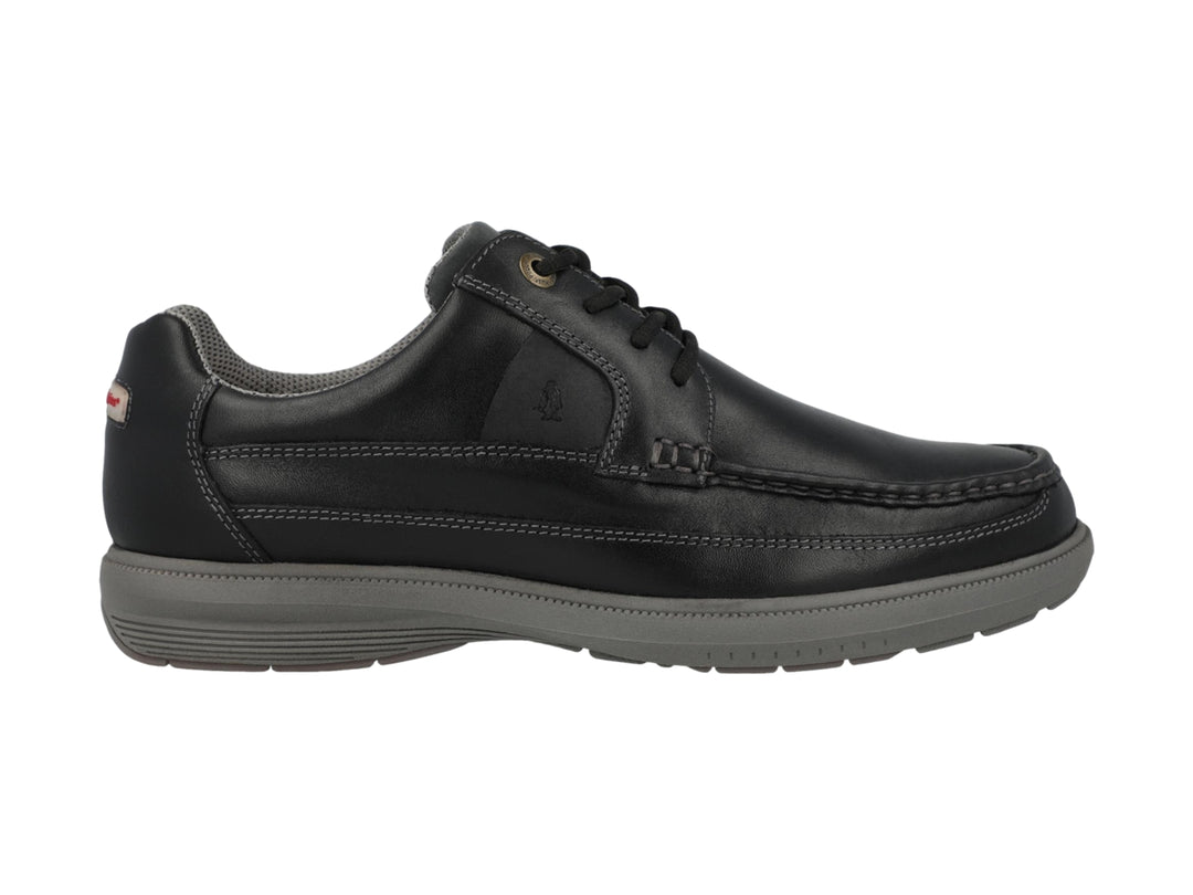 Zapato casual de cuero negro con suela gris y cordones.