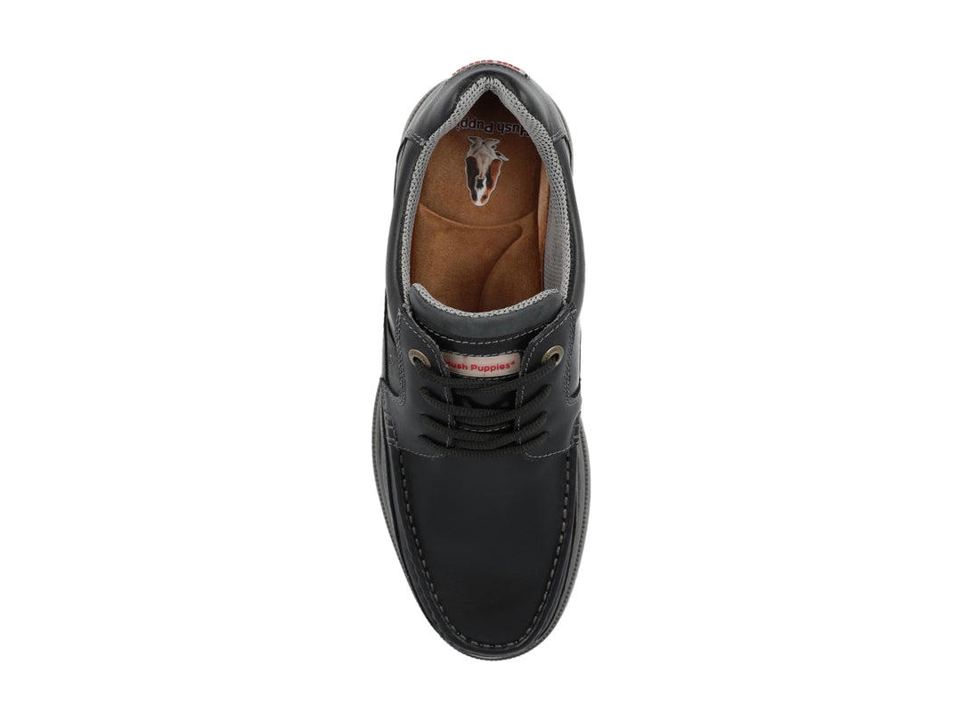Zapato casual de cuero negro con suela gris y cordones.