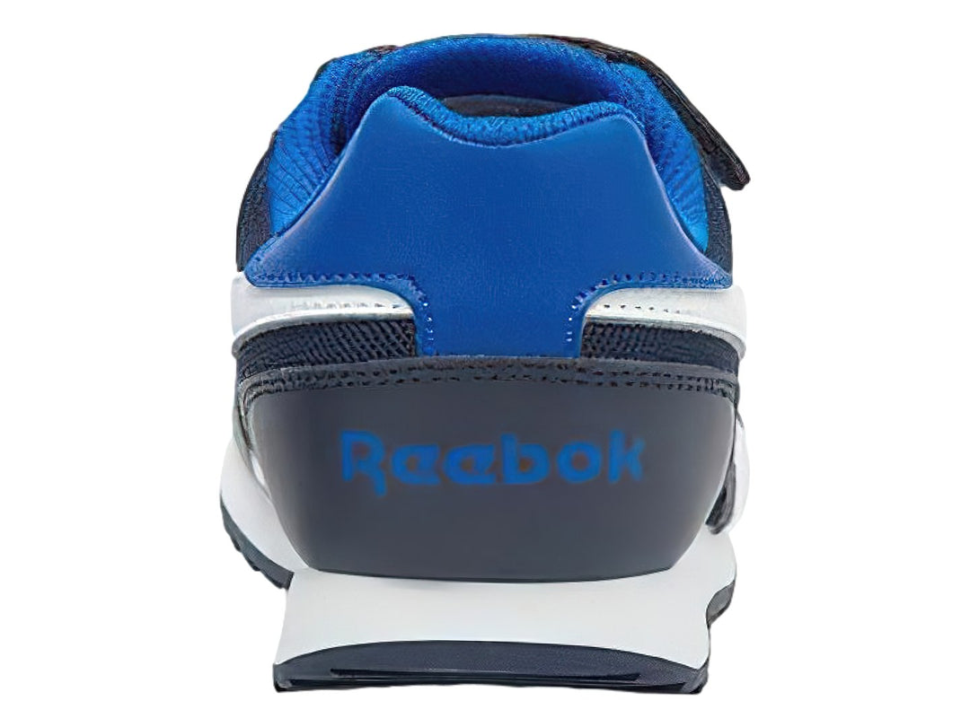 Tenis deportivos Reebok azul marino y blanco con correa de velcro para niño.