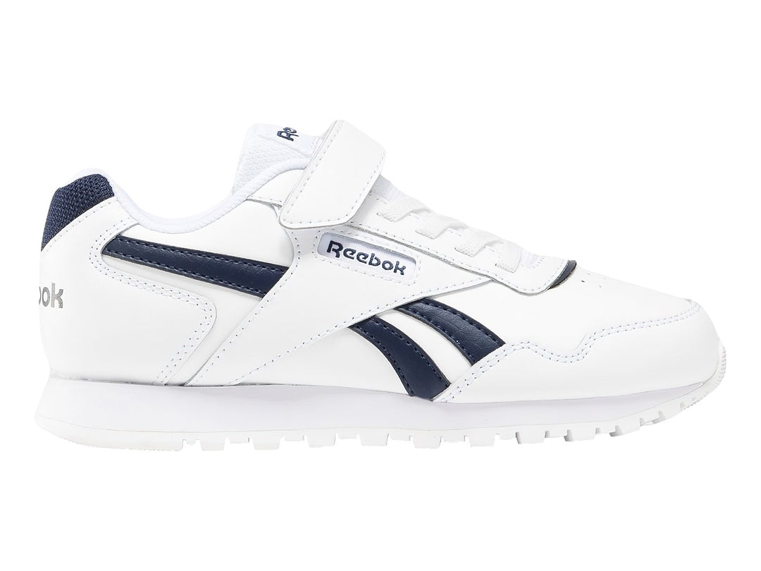 Tenis Reebok Royal Glide blancos con detalles en azul marino y cierre de velcro.