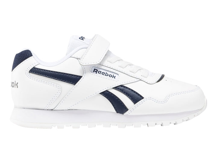 Tenis Reebok Royal Glide blancos con detalles en azul marino y cierre de velcro.