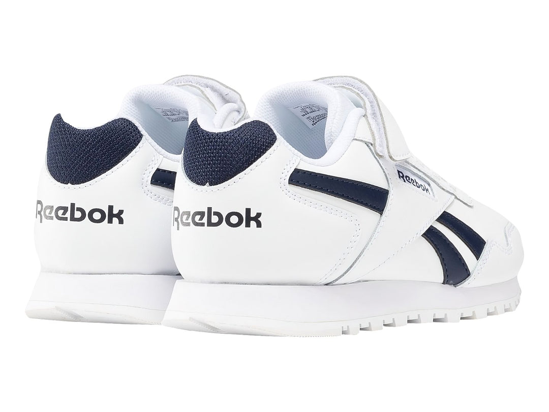 Tenis Reebok Royal Glide blancos con detalles en azul marino y cierre de velcro.