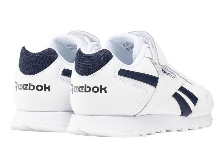 Tenis Reebok Royal Glide blancos con detalles en azul marino y cierre de velcro.