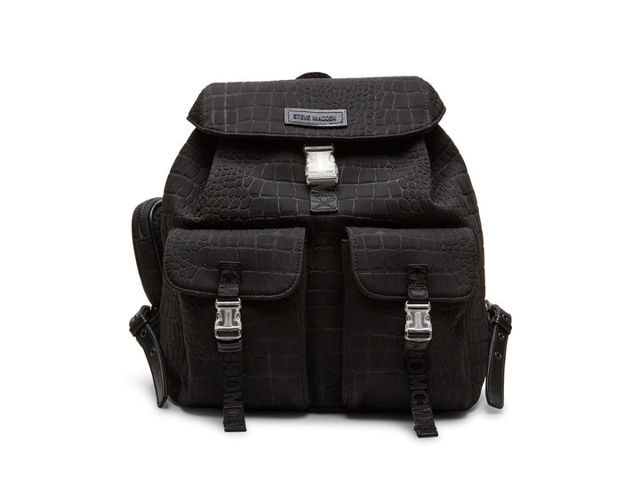 Mochila negra Steve Madden con textura rugosa, bolsillos frontales con hebillas plateadas y un pequeño bolso lateral.