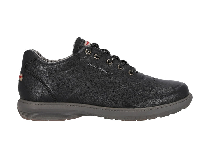 Zapato casual negro de la marca Hush Puppies con suela gris y cierre de agujetas.