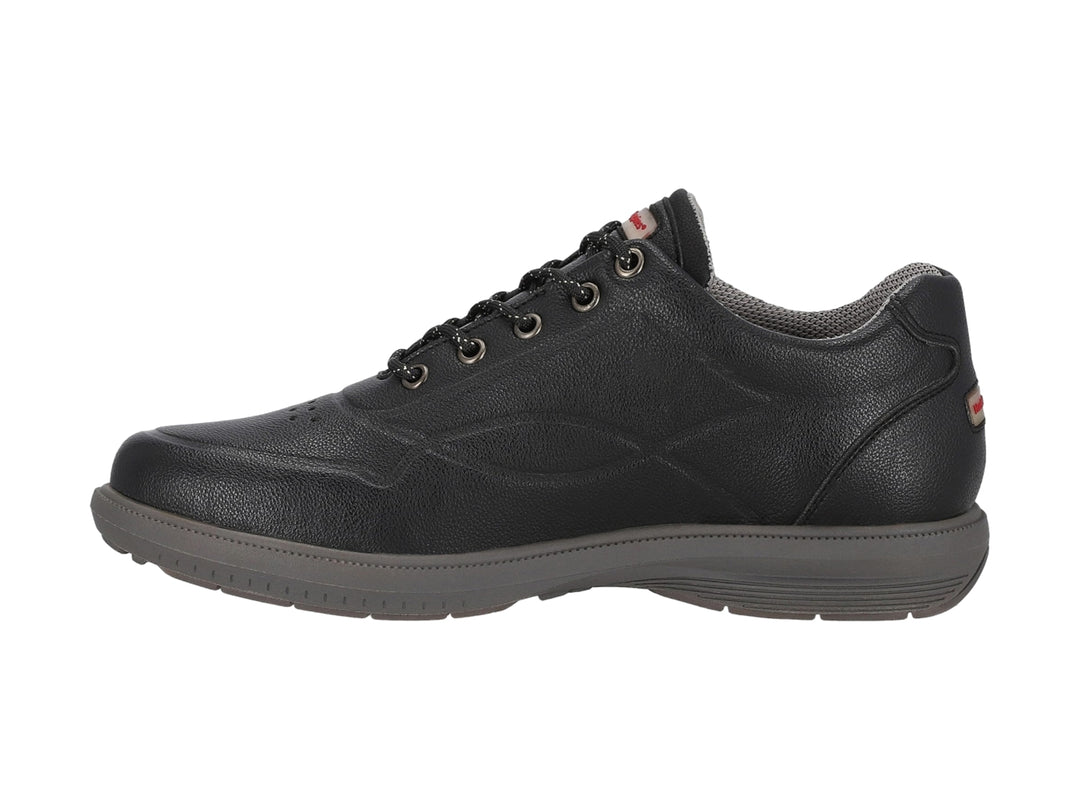 Zapato casual negro de la marca Hush Puppies con suela gris y cierre de agujetas.