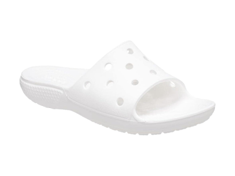 Par de sandalias Crocs Classic Slide V2 en color blanco con perforaciones circulares en la banda superior.