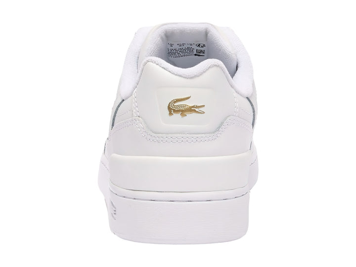 Tenis Lacoste blancos de cuero con logotipo dorado y suela blanca.