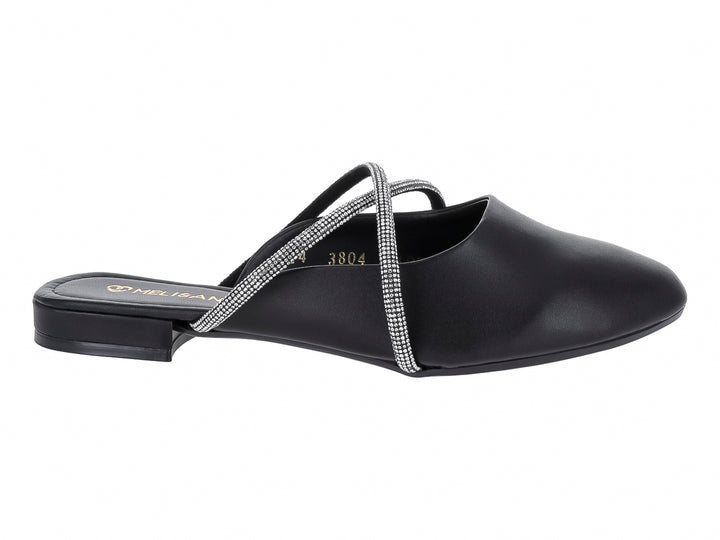 Zapato plano negro estilo mule con correas cruzadas decoradas con detalles brillantes plateados.