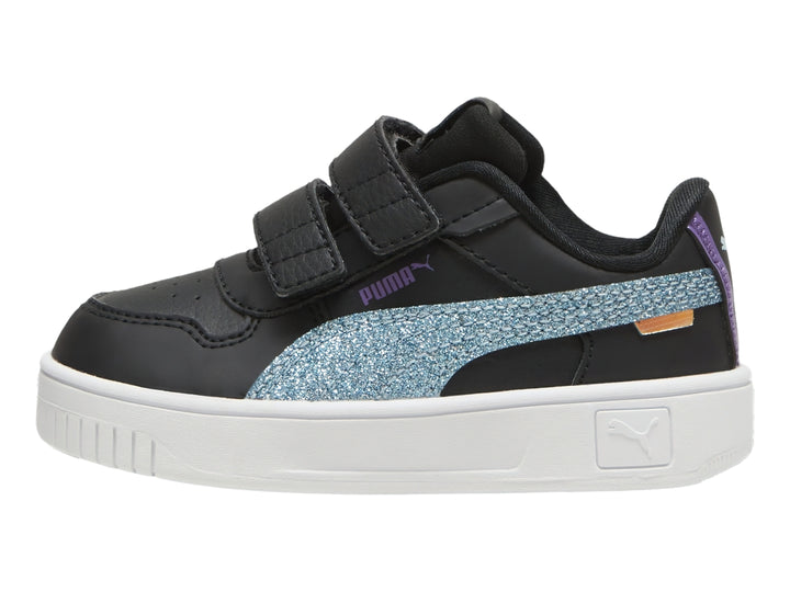 Tenis PUMA negros para niños con franja turquesa brillante y suela blanca.
