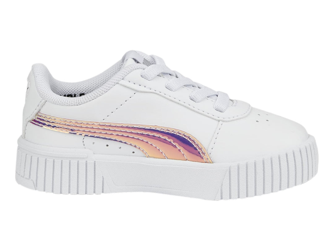 Tenis PUMA blancos para niños con franja lateral holográfica y suela de plataforma estriada.