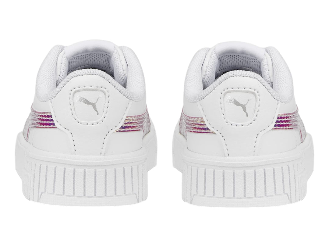 Tenis PUMA blancos para niños con franja lateral holográfica y suela de plataforma estriada.
