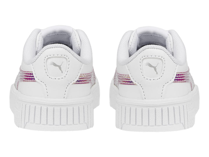 Tenis PUMA blancos para niños con franja lateral holográfica y suela de plataforma estriada.