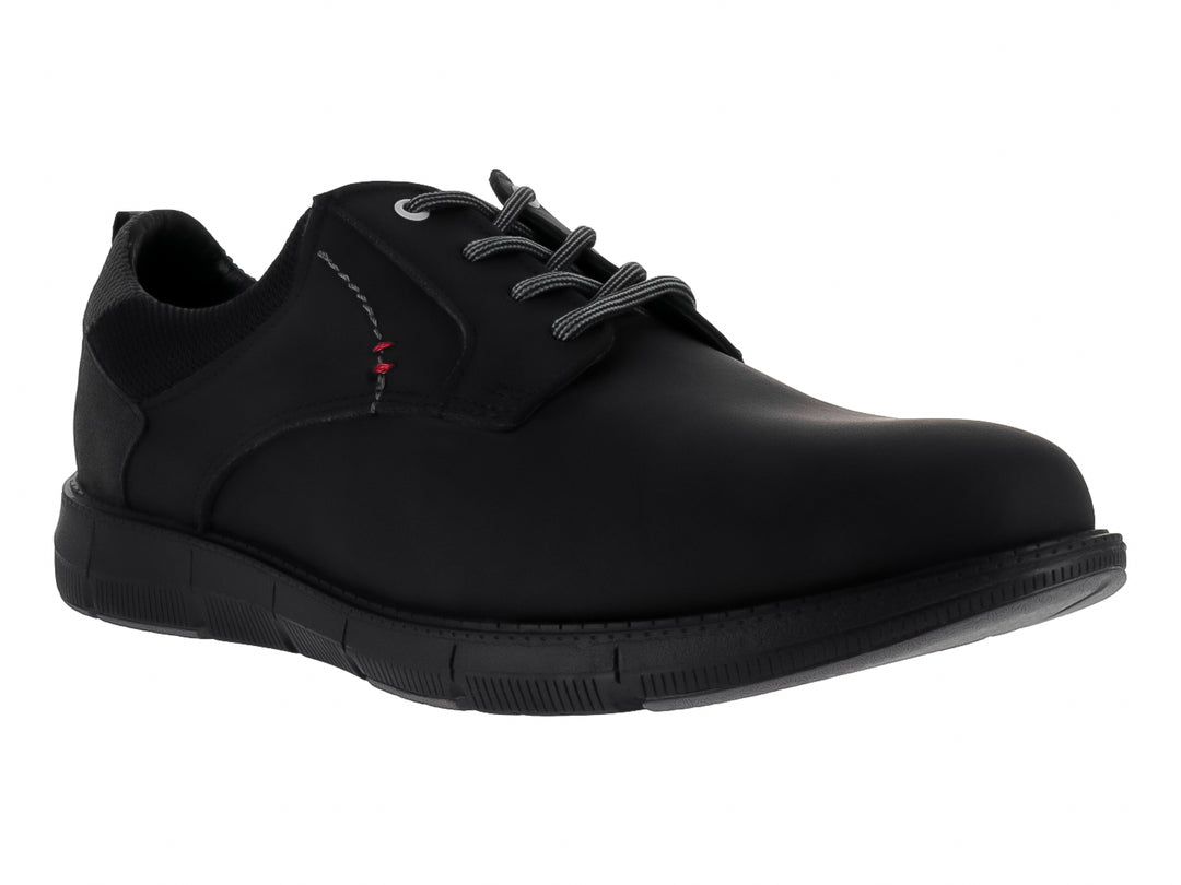 Zapato negro de material sintético con cordones grises y suela negra.