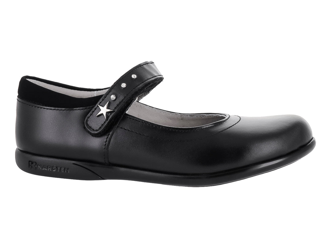 Zapato negro de piel para niña con correa y detalle de estrella plateada.
