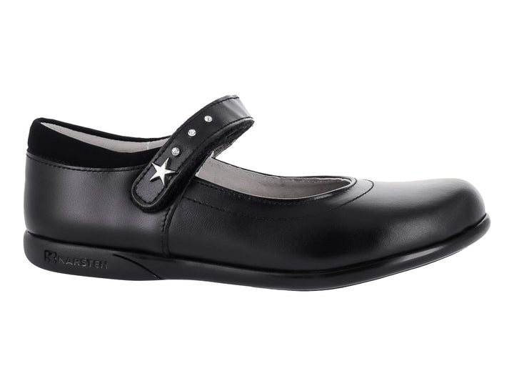 Zapato negro de piel para niña con correa y detalle de estrella plateada.