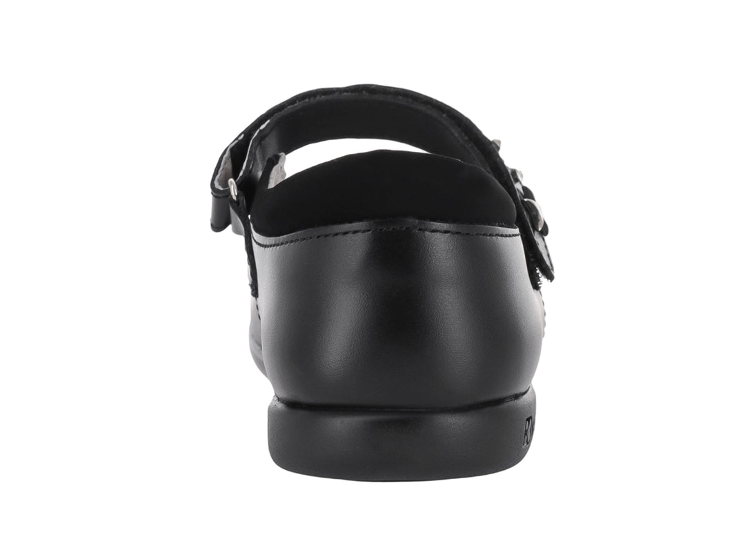 Zapato negro de piel para niña con correa y detalle de estrella plateada.