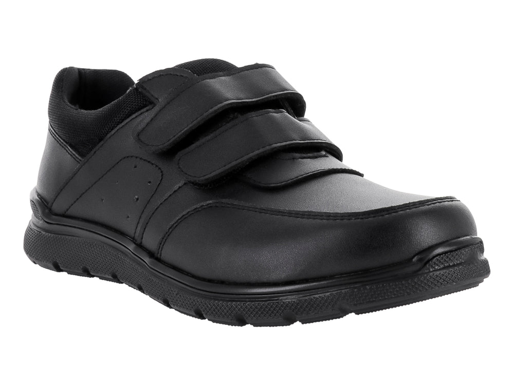 Zapato infantil color negro con cierre de velcro y suela negra.