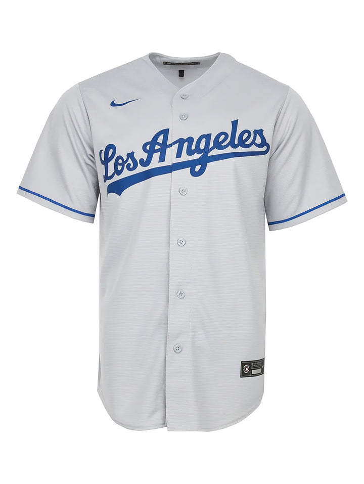 Jersey de béisbol Nike de los Los Angeles Dodgers en color gris con letras y detalles en azul.