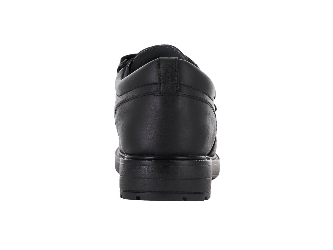 Zapato escolar negro para niño con cierre de velcro y suela resistente.